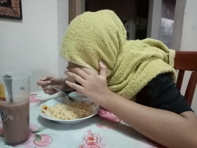 Girl eating noodles