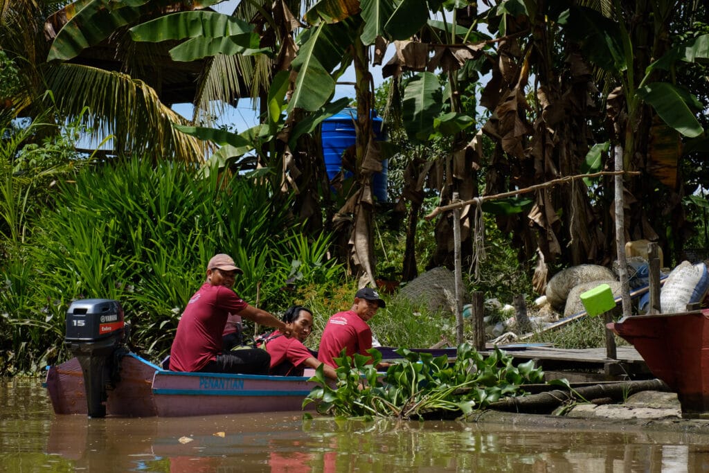 Azril and his friends aboard his Penantian.